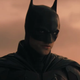 Robert Pattinson's Batman glowers in the haze of a Gotham sunset.